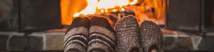 warm socked feet in front of a fire