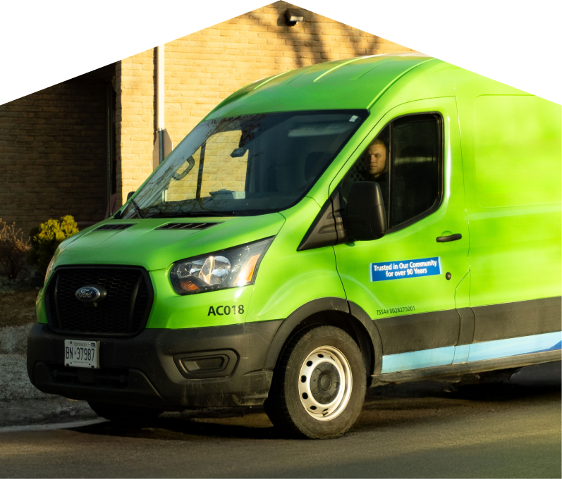 Romaniuk service van parked by a brick home highlighting trusted plumbing, heating & electrical expertise since 1961. Romaniuk service van parked by a brick home highlighting trusted plumbing, heating & electrical expertise since 1961.