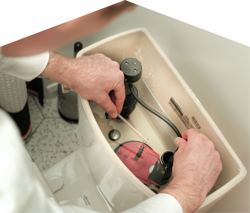 Romaniuk plumbing specialist adjusts internal components of a toilet tank, with tile flooring visible in the background. Romaniuk plumbing specialist adjusts internal components of a toilet tank, with tile flooring visible in the background.