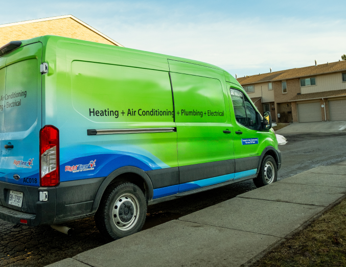 Romaniuk service van with HVAC, plumbing, and electrical branding parked in a suburban neighborhood, promoting local trust. Romaniuk service van with HVAC, plumbing, and electrical branding parked in a suburban neighborhood, promoting local trust.